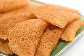 Kuih Jala, kuih tradisional masyarakat Siam yang berbentuk halus dan berjalin.