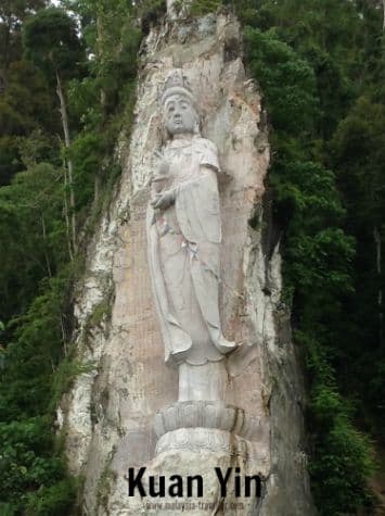 Kuan Yin statue carved into the hillside at Wat Koh Wanararm, Langkawi, Kedah